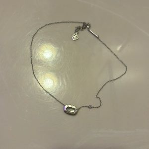 sliver necklace with light blue gem inside